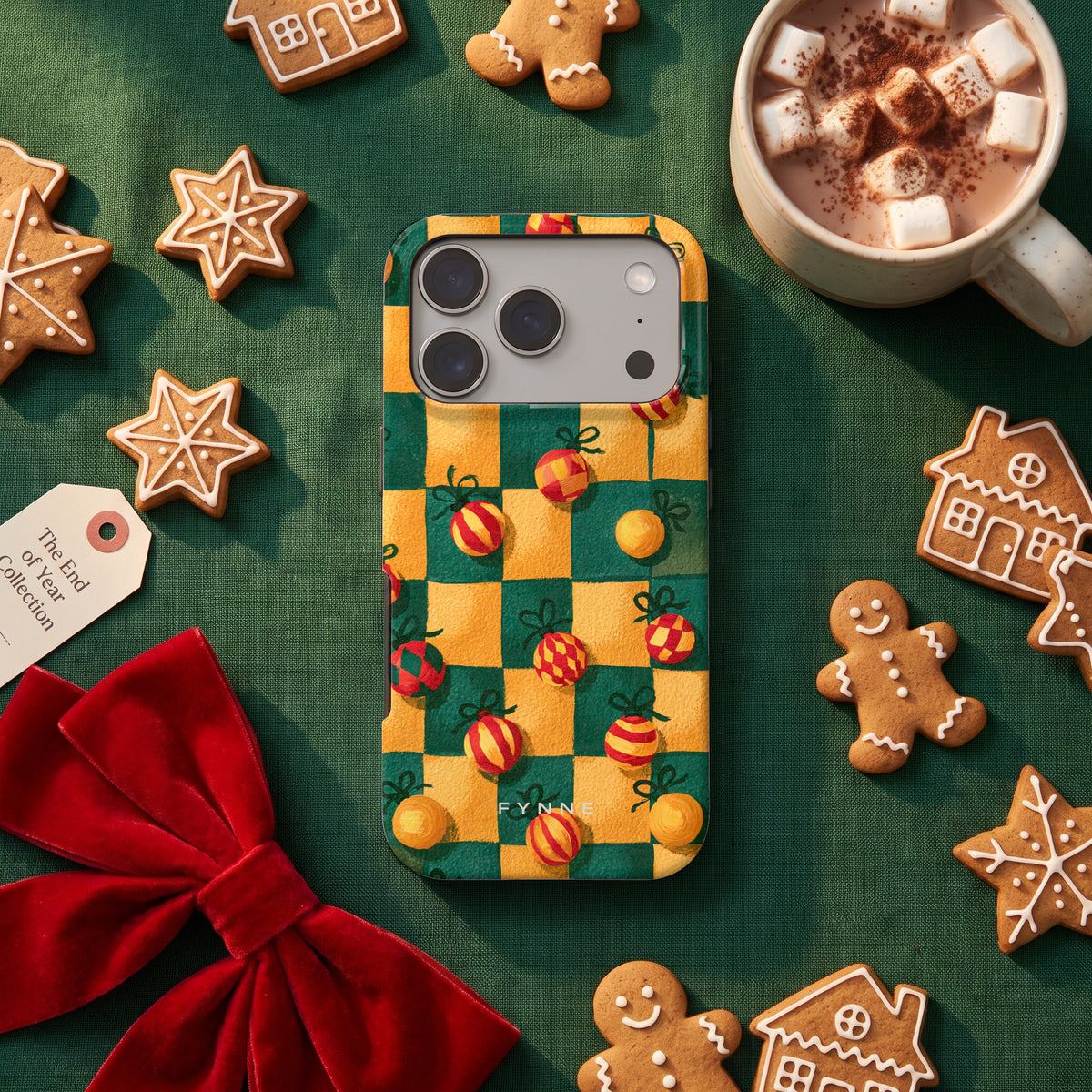 Geblokte Kerstballen hoesje op een iPhone 17 Pro, uit The End of Year Collection
