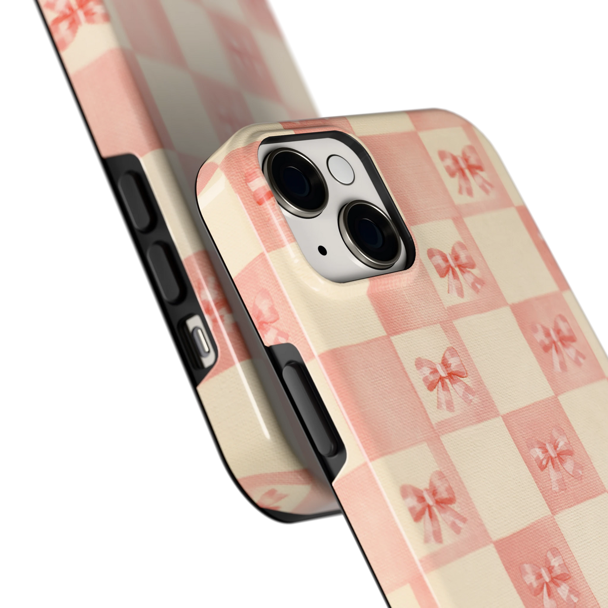 Roze strikjesgeruit hoesje voor iPhone 14 Plus, close-up