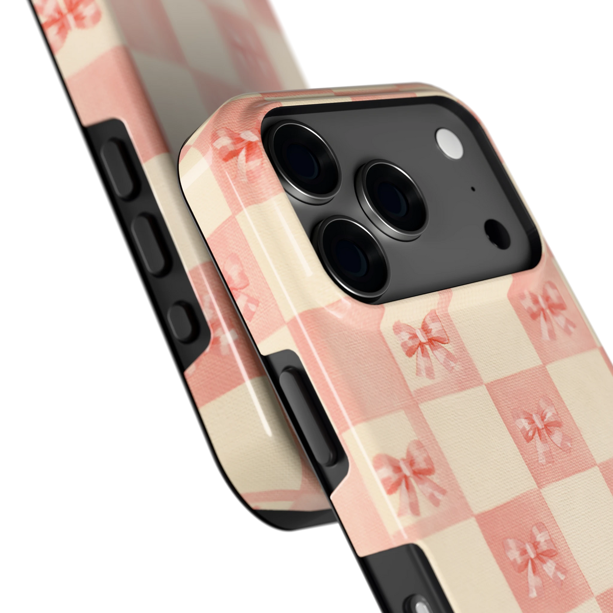 Roze strikjesgeruit hoesje voor iPhone 17 Pro, close-up